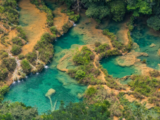 Semuc champey natural bridge of limestone in the cahabon river of Guatemala in the middle of the...