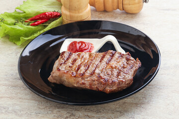 Grilled rib-eye steak beef meat