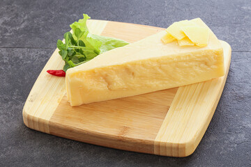 Parmesan cheese piece over board