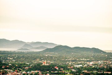 Panoramic nature background (mountains, sea, trees, twilight lights in the sky, waterfront communities), naturally blurred through the wind, seen on tourist spots or scenic spots