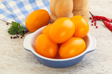 Sweet ripe yellow tomato in the bowl