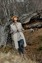 portrait of a woman in an orange hat nature autumn life style