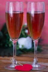 Valentines day background with champagne glasses and red roses