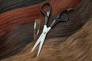 Female hair, hair clip and scissors, close up