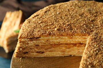 Concept of tasty dessert with honey cake, close up