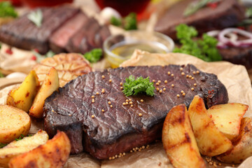 Concept of tasty food with beef steaks, close up