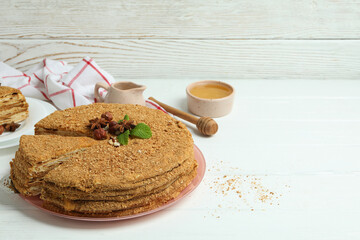 Fototapeta na wymiar Concept of tasty dessert with honey cake, space for text