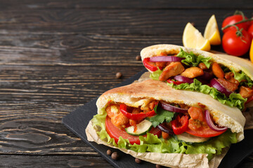 Concept of tasty food with pita with chicken, space for text