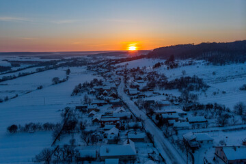 Aerial shot: Sunset in Winter Willage