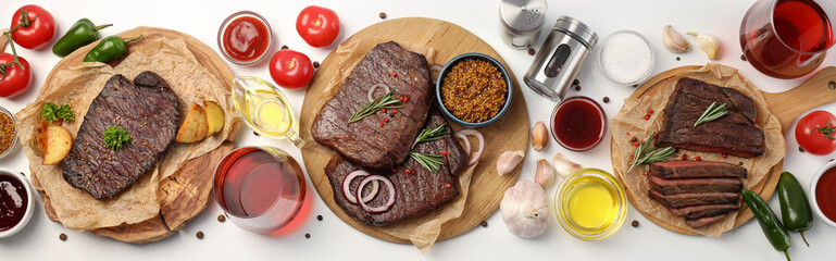 Concept of tasty food with beef steaks, top view