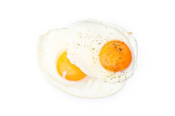 Fried eggs with spices isolated on white background