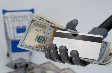 robot hand holds money and a credit card. concept of trading using artificial intelligence.