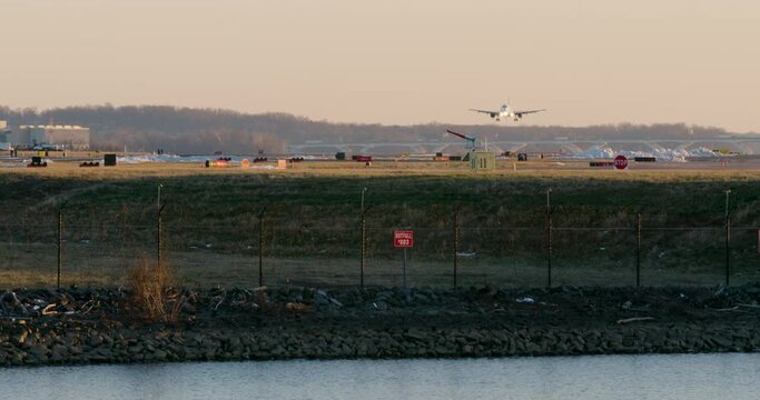 Commercial Jet Landing With Water In Foreground At Washington D.C.&rsquo;s DCA Airport