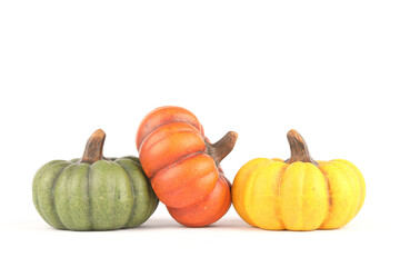 Pumpkins made out of clay isolated on white
