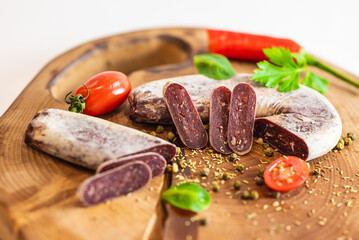 Fresh meat and vegetables on wooden boards