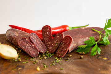 Fresh meat and vegetables on wooden boards