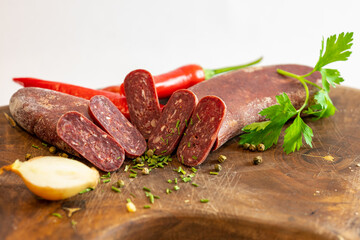 Fresh meat and vegetables on wooden boards