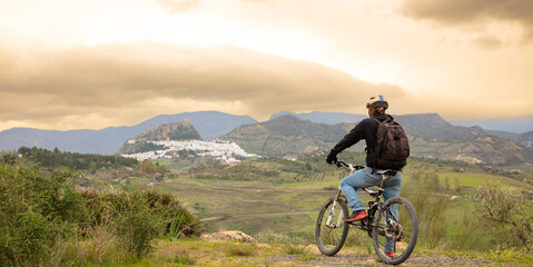 Fototapeta na wymiar man and bike enjoying landscape view