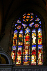 Fototapeta na wymiar Bologna, Italy: Stained glass window in basilica di San Petronio in the square, Piazza Maggiore 