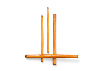 Four bamboo sticks to massage the face and other parts of the body.