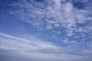 blue cloudy sky on a sunny day background screensaver backdrop