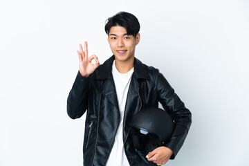 Chinese man with a motorcycle helmet isolated on white background showing ok sign with fingers