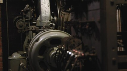 Dramatic close up shot of a running elevator shaft with metal bars in vintage apartment building
 - Powered by Adobe