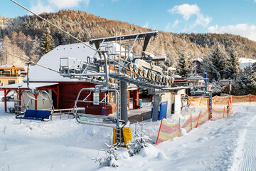 Naklejka premium Bottom station of ski-lift chair at resort Snowland Valca in winter season.