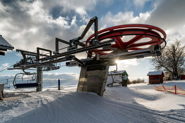 Upper station of ski-lift chair at resort Snowland Valca in winter season.