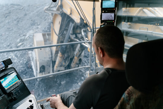 The driver works in the excavator cab.