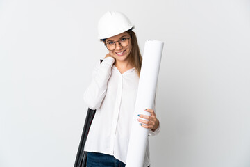 Young Lithuanian architect woman with helmet and holding blueprints isolated on white background laughing