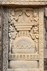 Fototapeta na wymiar Stupa No 3, Front Face, Left Pillar Panel 1: Garlanding the Stupa. World Heritage Site, Sanchi, Madhya Pradesh, India.
