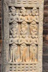 Fototapeta na wymiar Stupa No 3, Front Face, Panel 2 and 3 on both pillars. Devotees worshipping Buddha. World Heritage Site, Sanchi, Madhya Pradesh, India.