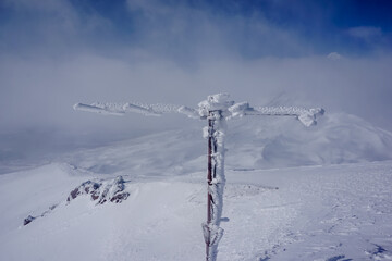 Frozen antenna on the ridge of Avachinsky volcano in winter