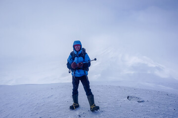Fototapeta na wymiar Hiker at the Avachinsky Pass and volcanoes in Kamchatka
