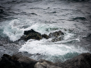 Waves crashing on rocks