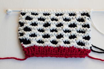 knitting background featuring honeycomb stitch in chunky yarn 