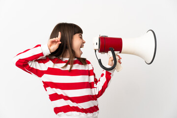 Little girl isolated on white background shouting through a megaphone to announce something in...