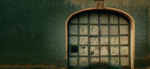 vintage door on the facade of an ancient building space for text