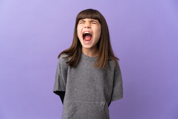 Little girl over isolated background shouting to the front with mouth wide open