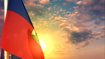 Haiti flag is hanging on sunset sky for day of the flag - defocused - object 3D illustration