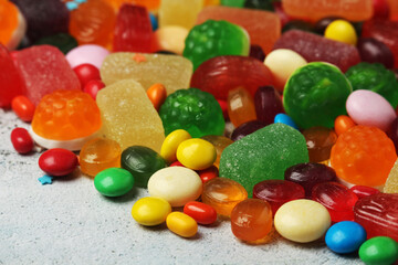 Bright candy lollies on white background	