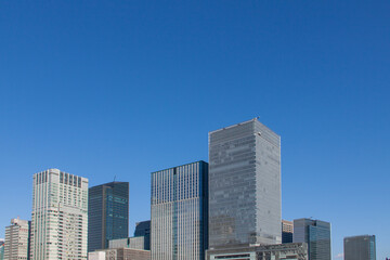 Fototapeta na wymiar High-rise business buildings under the blue sky