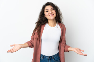 Fototapeta premium Teenager Russian girl isolated on white background happy and smiling