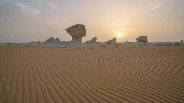 Timelapse of chalk rocks in the White Desert at sunset. Egypt, Baharia