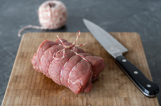 Meat Tied Into A Roll For A Roast With Kitchen Twine