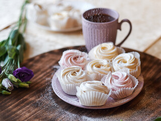 confectioner sprinkles icing sugar with dessert. Powder sugar falls on fresh perfect cupcakes or meringues