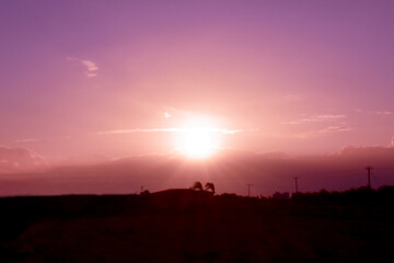 Countryside landscape with purple morning sunlight sky background.
