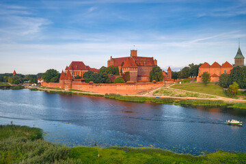 Naklejka na ściany i meble Beautiful Malbork castle over the Nogat river, Poland