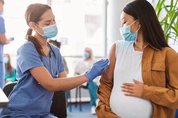 Pregnant Woman Preparing To Get Vaccinated Against Covid-19